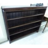 A late Victorian mahogany four tier open front bookcase,