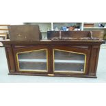 Small furniture: to include an early 20thC stained oak hanging display cabinet with a pair of