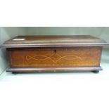 An Edwardian satinwood inlaid mahogany jewellery casket with a hinged lid,