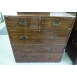 A late Victorian mahogany two section military chest with inlaid brass brackets and recessed