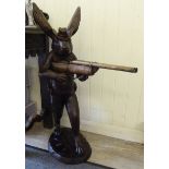 A modern cast and patinated bronze 'hunting hare' holding a double barrelled shotgun 34''h