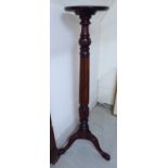 A mid 19thC design mahogany torchere,