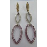 A pair of 9ct white gold earrings,