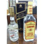 A bottle of Johnnie Walker Black Label whisky; a bottle of Gordon's London dry gin;