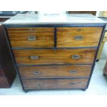 A mid 19thC mahogany military style, brass inlaid two part four drawer dressing chest,