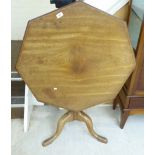 A George III mahogany pedestal table with an octagonal tip-top,