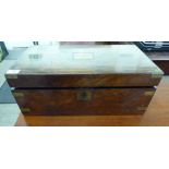 A late Victorian walnut writing slope with a hinged lid and straight sides,