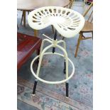 A cream painted metal stool,