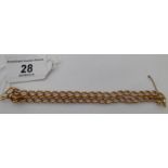 A 9ct gold double curb link bracelet 11