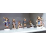 Six Goebel Margaret Hummel porcelain figures: to include a carol singer 5.