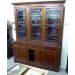 An Edwardian satinwood inlaid mahogany cabinet bookcase with a dentil moulded cornice,