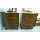 A pair of modern mahogany finished serpentine front, four drawer bedside chests,