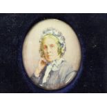 M Dovaston - an oval head and shoulders portrait miniature,