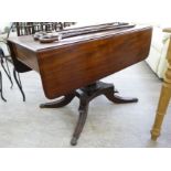 An early 20thC light oak kitchen table with a single central drawer, raised on turned,