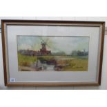 Mary Hoad - a windmill in a landscape with a river watercolour bears a signature 9.5'' x 18.