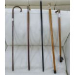 Five various Victorian and later walking canes with silver and white metal caps and/or handles