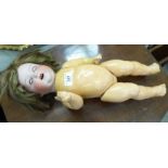 An early 20thC Armand Marseille bisque head doll with weighted sleeping eyes and painted features,