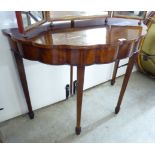 An early 19thC and later crossbanded mahogany demi-lune side table with a repeating bow front,