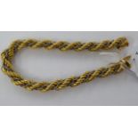 A 14ct bi-coloured gold ropetwist and entwined chain bracelet,