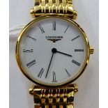 A lady's Le Grande Classique de Longines yellow metal plated, round cased bracelet wristwatch,