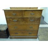 An early 20thC light oak dressing chest,