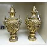 A pair of mid 20thC Victorian design cast brass cassoulets,