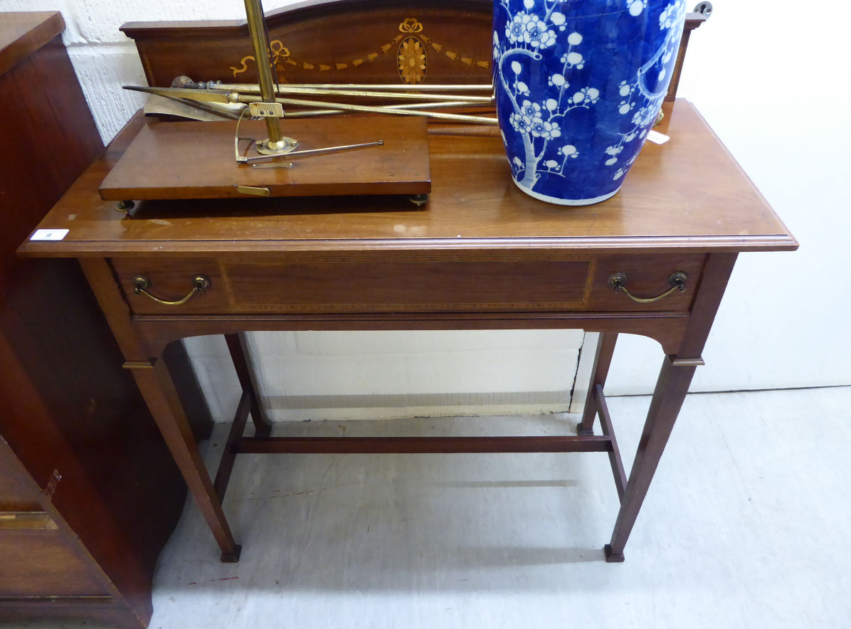 An Edwardian mahogany washstand with a marquetry upstand, over a frieze drawer, raised on square,