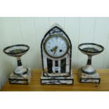 A late 19thC black and cream mottled marble cased mantel clock;