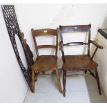 A mid 19thC Windsor fruitwood oak and elm framed open arm chair with a solid seat,