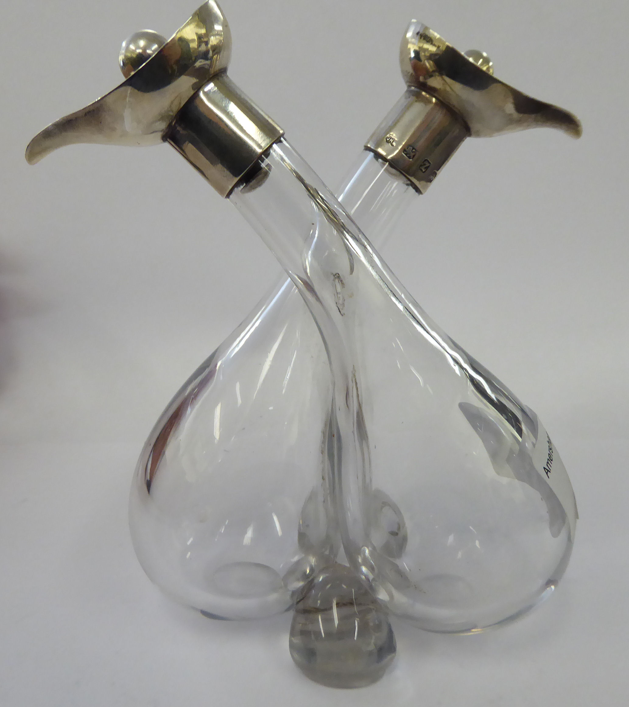 A pair of conjoined blown glass oil/vinegar bottles with silver mounts Birmingham 1924 11