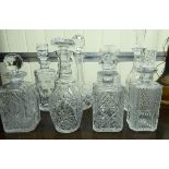 Eight cut crystal decanters with stoppers various ages,