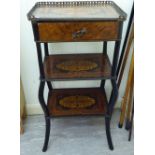 A late 19thC French walnut and marquetry inlaid three tier etagere, the top with a brass gallery,