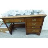 An early 20thC and later single pedestal four drawer desk,