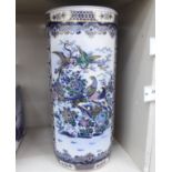 A 20thC Oriental ceramic stickstand of cylindrical form,