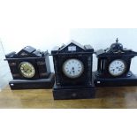 Three early 20thC black slate cased mantle clocks,