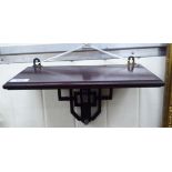 An early 20thC mahogany wall bracket,