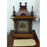 An early 20thC German oak cased mantel clock;