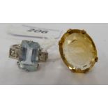 A 9ct gold dress ring, claw set with a citrine; and a 9ct white gold ring, set with an aquamarine,