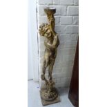 An 'antique' finished composition candlestick pedestal,