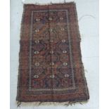A Persian rug with a central gul medallion on a blue ground 56'' x 32'' HSL
