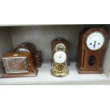 Five early 20thC mantle clocks: to include an oak cased example,