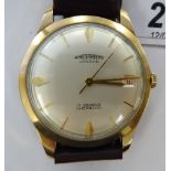 A Winegartens 9ct gold wristwatch, faced by a baton dial with a date aperture,