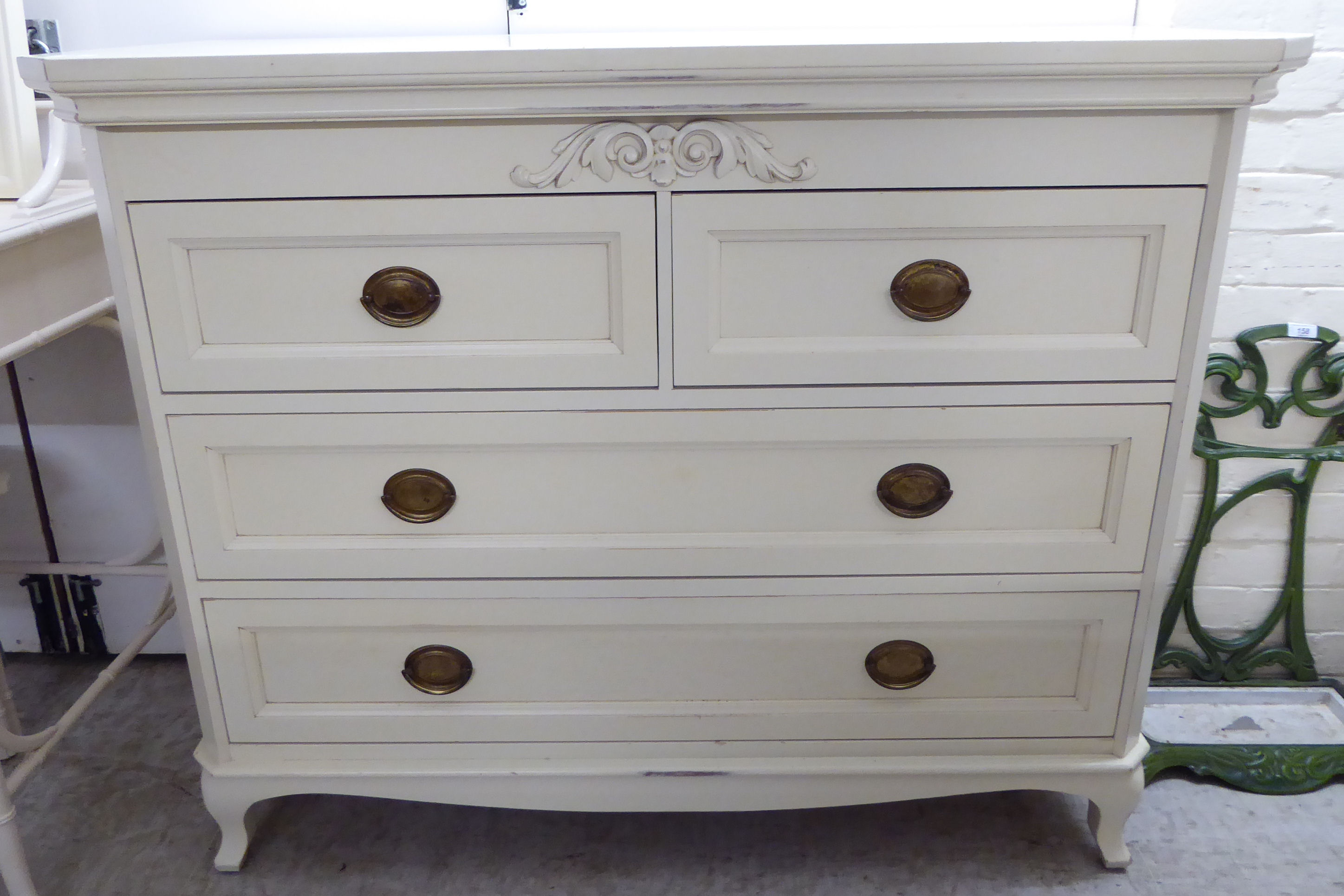 A Laura Ashley cream painted four drawer dressing chest,