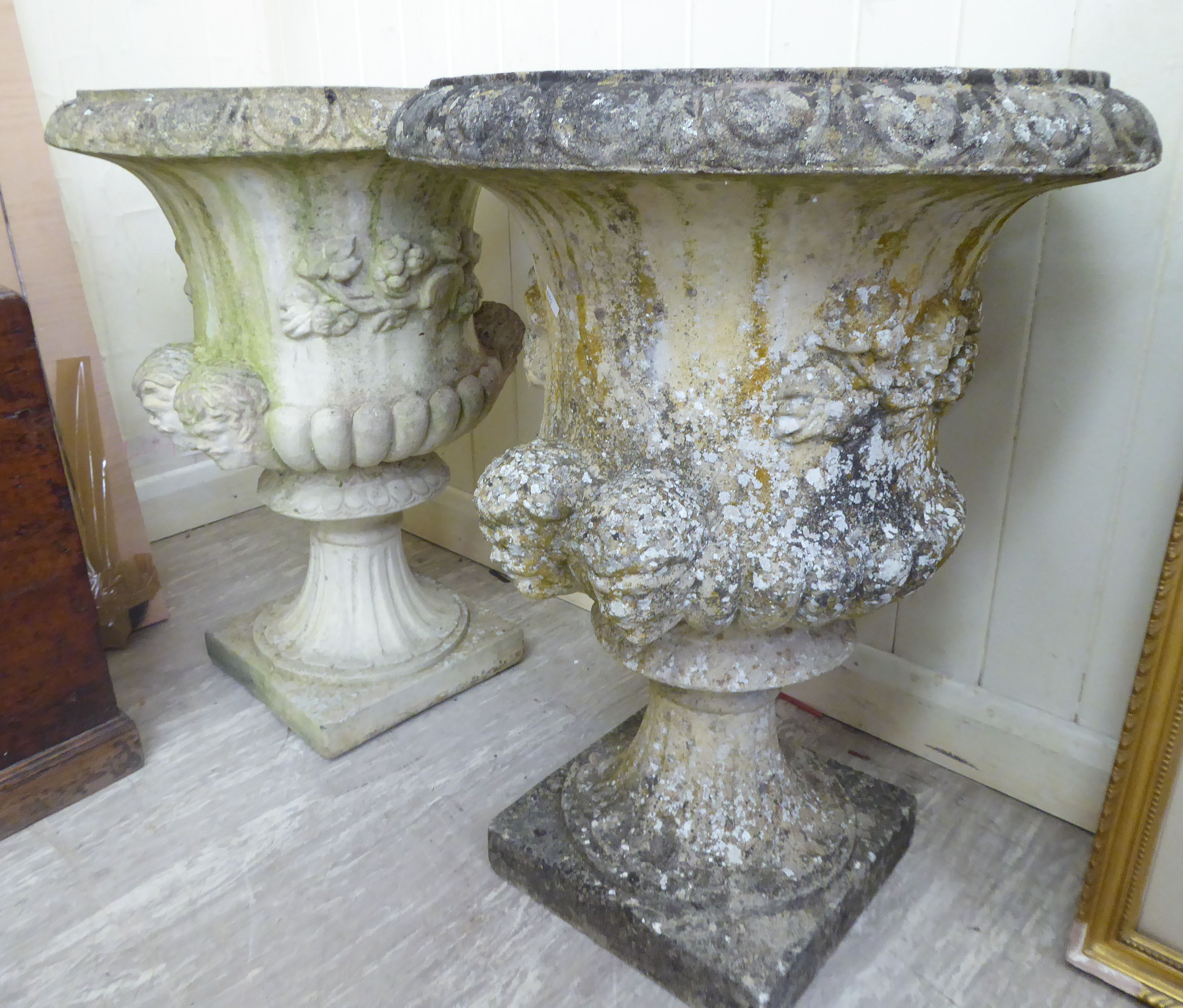 A pair of composition stone campana design garden urns 26''h 19.