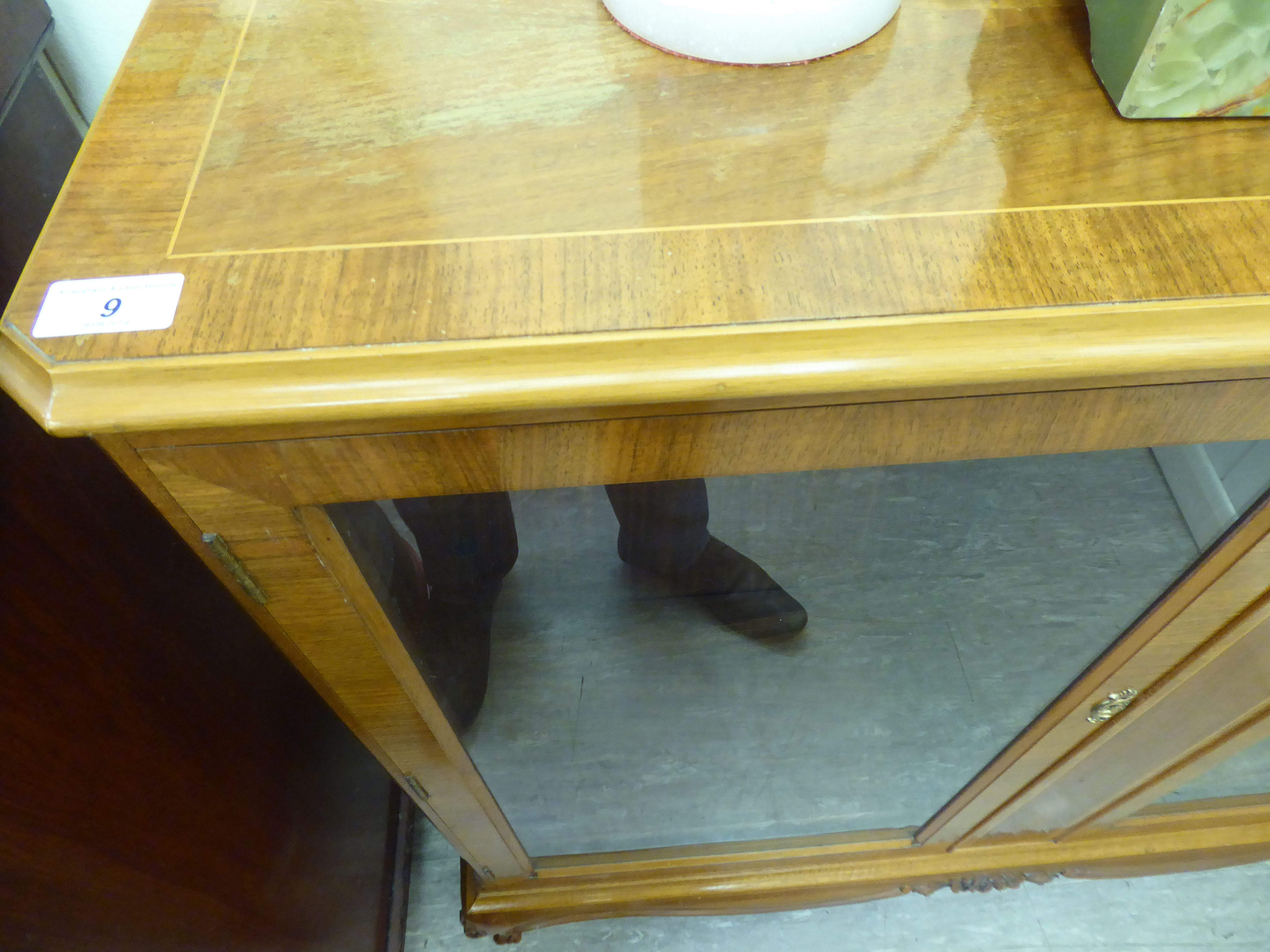 A mid 20thC walnut veneered display cabinet with two glazed doors, - Image 2 of 2