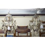 A pair of early 20thC brass wire framed hanging lights with variously cut crystal pendants