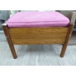 A modern rosewood framed stool with a pink fabric upholstered cushioned seat F