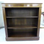 A modern Edwardian style mahogany open front bookcase with two shelves,