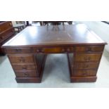 A modern mahogany partners' twin pedestal desk with a tooled and gilded brown hide scriber,