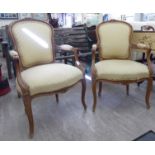 A pair of mid 20thC Louis XV design salon chairs with beige upholstered backs and seats,